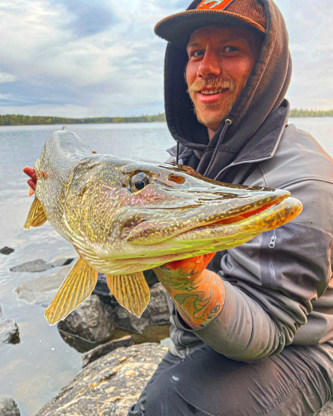 Casting into the vibrant embrace of spring, Manitoba's pike fishing brings joy and excitement to every angler's heart.